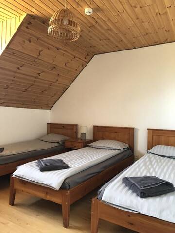 Фото номера Трехместный номер с собственной ванной комнатой Гостевой дом Viesu nams Vālodzes г. Сигулда 4
