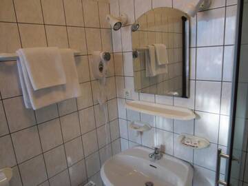 Фото номера Двухместный номер с 2 отдельными кроватями Гостевой дом Livonija г. Сигулда 5